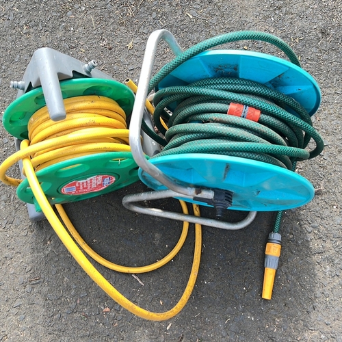 59 - 2 hose reels.