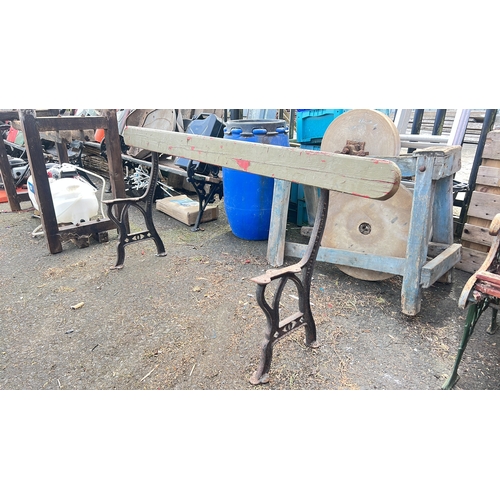 60 - Cast-iron based bench with a shaped timber seat rail, the side supports cast in relief 'J P Correy  ... 