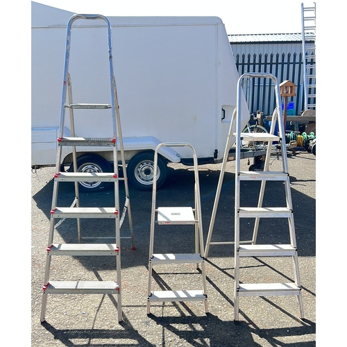 8 - An assortment of 3 step ladders.