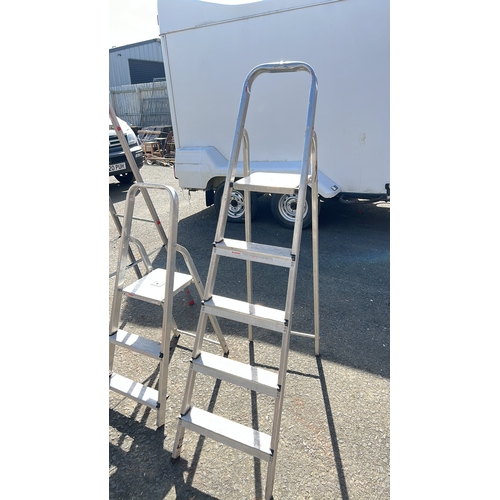 8 - An assortment of 3 step ladders.