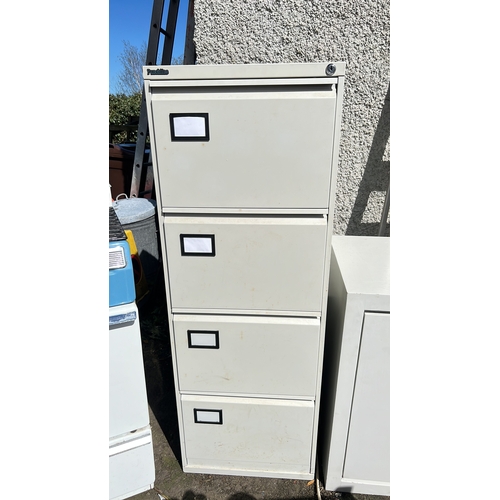 9 - A 4 drawer filing cabinet.