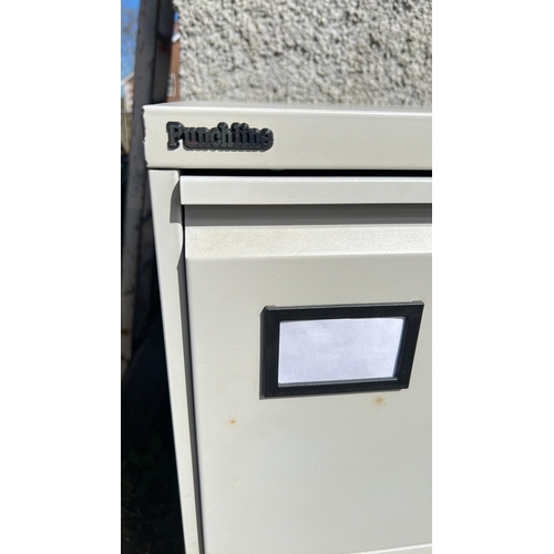 9 - A 4 drawer filing cabinet.