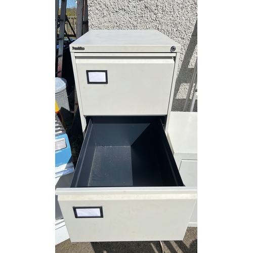 9 - A 4 drawer filing cabinet.