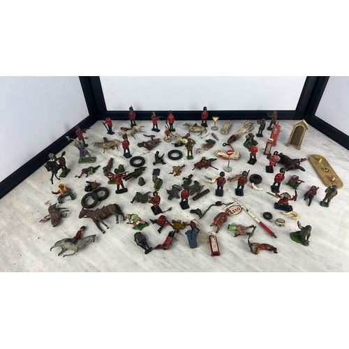 144 - A collection of painted lead and composition toy soldiers and accessories, including Guardsmen, moun... 
