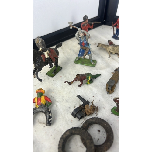 144 - A collection of painted lead and composition toy soldiers and accessories, including Guardsmen, moun... 