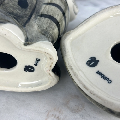 147 - 2 ceramic “Cumberland” cat figures.