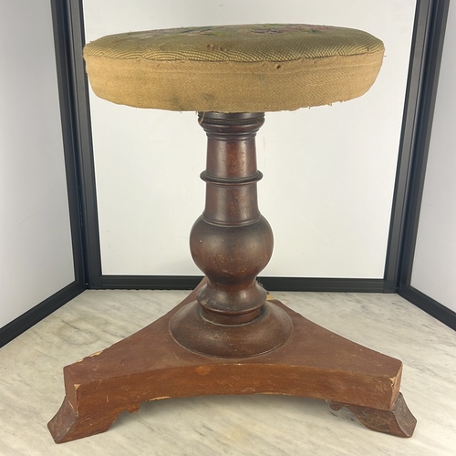 152 - Late 19th/early 20th century tripod piano stool in mahogany, the turned baluster column raised on th... 