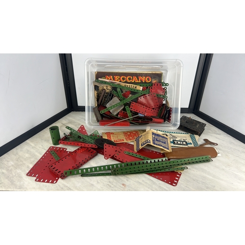 160 - A quantity of vintage Meccano constructional toy parts, comprising red and green perforated plates a... 