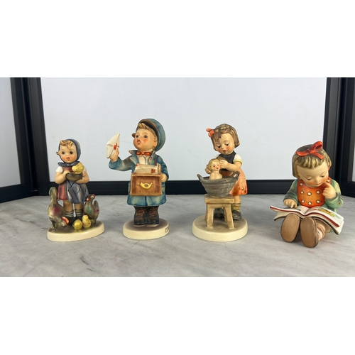 163 - A collection of 4 Goebel Hummel figures.
