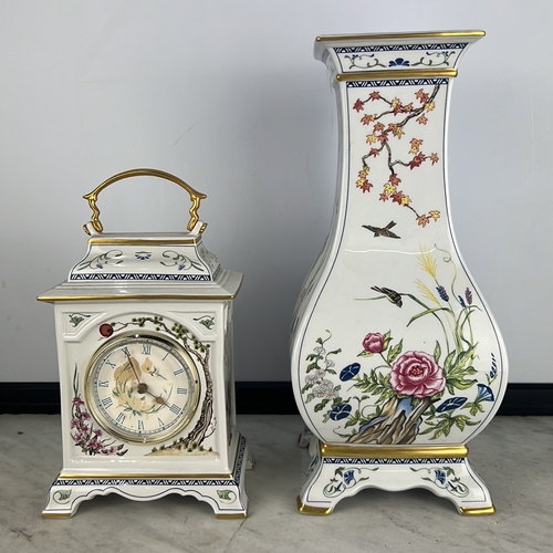 165 - 2 Franklin Mint pieces, to include a porcelain carriage clock with gilt handle and floral-painted ca... 