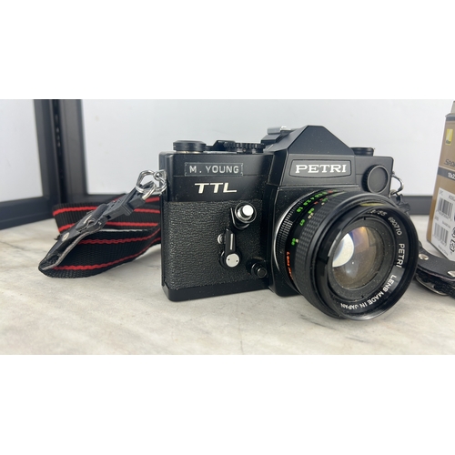 171 - A Petri TTL 35mm SLR camera with Petri lens &  Nikon Sport Lite 10x25 DCF binoculars in original box... 