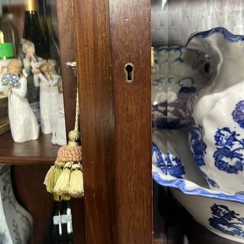 173 - Late Victorian mahogany breakfront bookcase, the cornice above glazed doors enclosing adjustable she... 