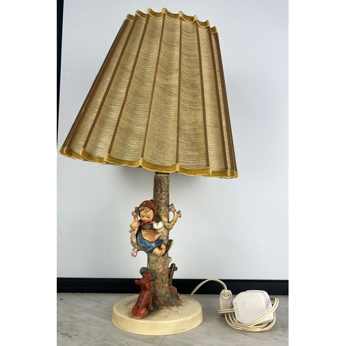 177 - A Goebel Hummel table lamp with shade.