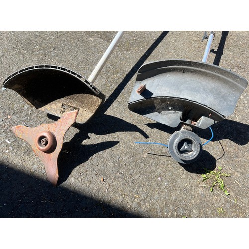 123 - Two petrol strimmers.