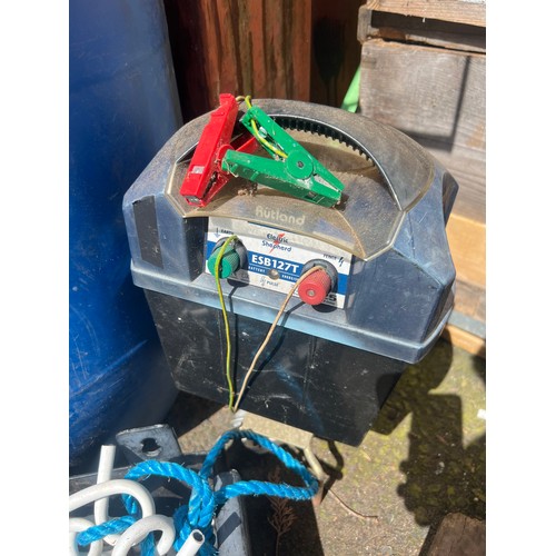 48 - A large lot of electric fence posts, cable, power pack and more.