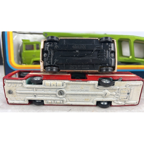 A group of die-cast model vehicles, including a Corgi racing