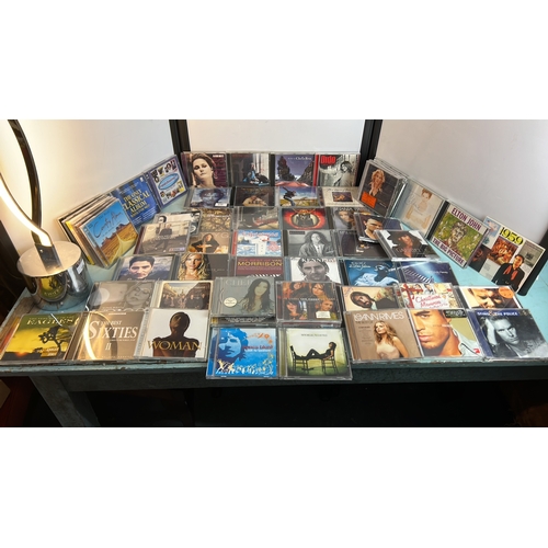 A group of commercially released compact discs, predominantly late 20th ...