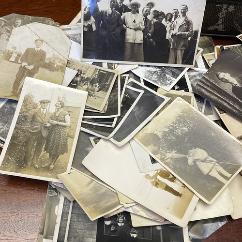 33 - A quantity of early to mid-20th century photographs, mostly black-and-white portrait and group studi... 