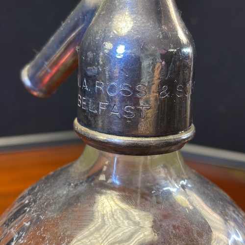 51 - Ross’s Royal Belfast Table Waters soda siphon, early 20th century—ribbed clear-glass bottle with aci... 