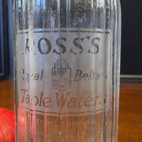 51 - Ross’s Royal Belfast Table Waters soda siphon, early 20th century—ribbed clear-glass bottle with aci... 