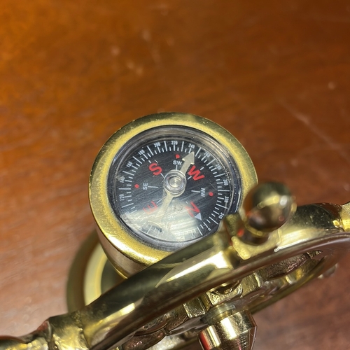 56 - A group of nautical-themed desk accessories comprising a brass ships log by J. Walker & Son Ltd., Bi... 
