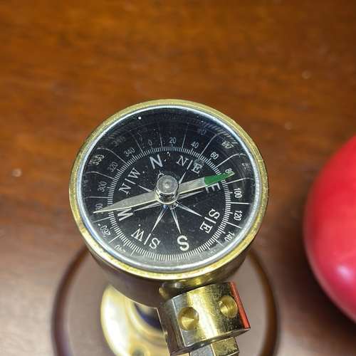 56 - A group of nautical-themed desk accessories comprising a brass ships log by J. Walker & Son Ltd., Bi... 