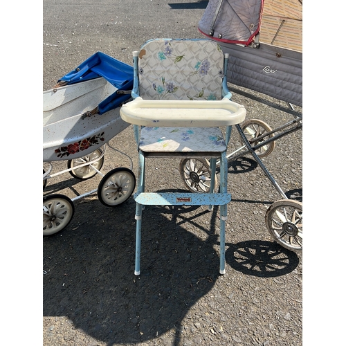 29 - A group of vintage infant and toddler equipment comprising a metal bodied pram with quilted hood on ... 