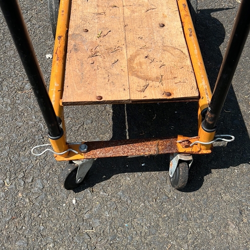 6 - Industrial platform trolley with tubular steel handle, painted metal frame and timber deck, fitted w... 