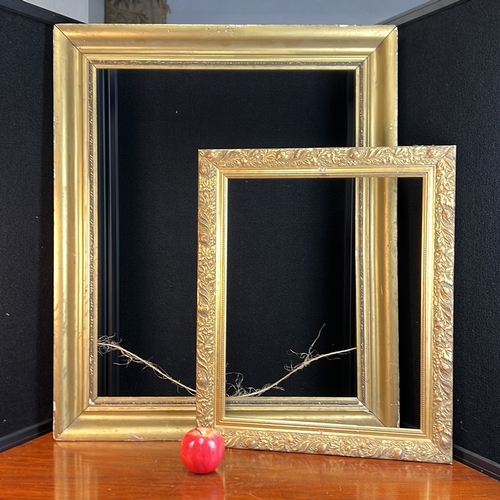 Two rectangular gilt picture frames: the larger with broad coved ...
