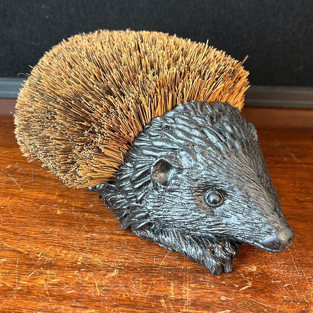 Hedgehog-form boot brush, its dark-finished moulded body detailed with ...