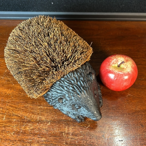 Hedgehog-form boot brush, its dark-finished moulded body detailed with ...