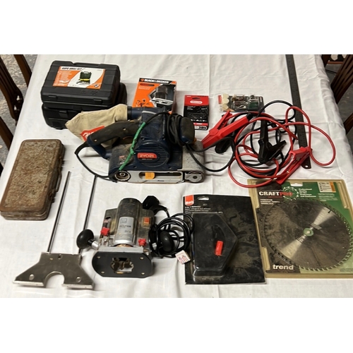 A group of workshop tools and accessories, including a Ryobi EBS-1310V ...