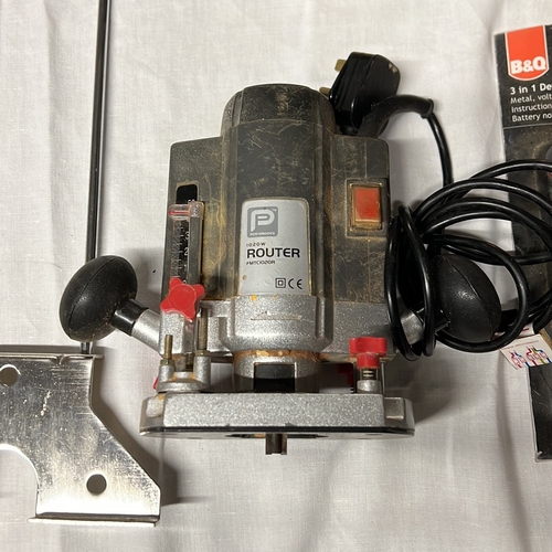 A group of workshop tools and accessories, including a Ryobi EBS-1310V ...