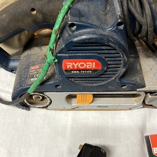 A group of workshop tools and accessories, including a Ryobi EBS-1310V ...