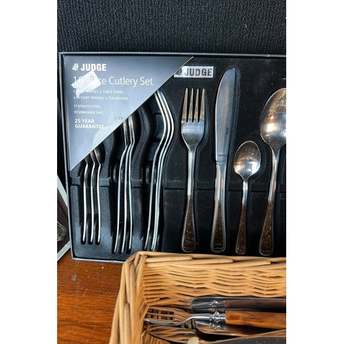 A collection of table cutlery, including boxed shell-pattern spoons, a ...