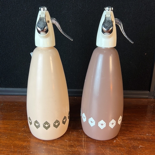 A pair of BOC Sparklets soda syphons, made in England, with cream and ...