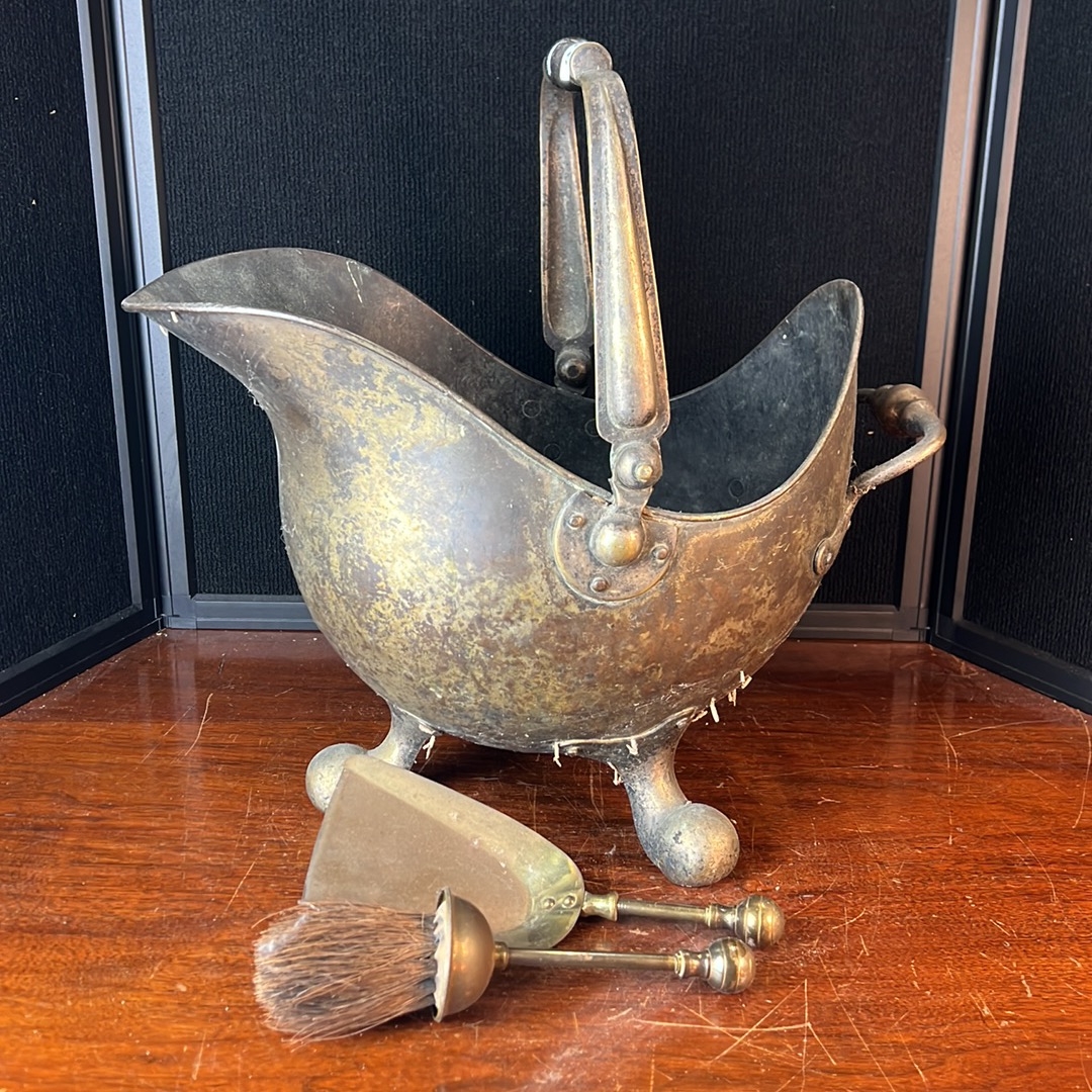 Helmet-form metal coal scuttle with a swing handle, rear grip and ball ...