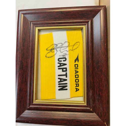 378 - Steven Gerrards Captains Armband in a frame.