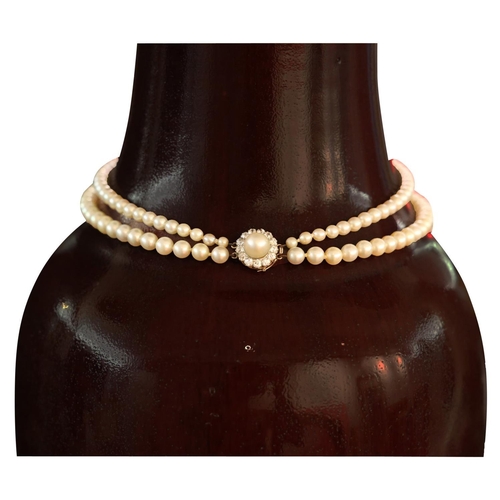 61 - A DOUBLE STRAND PEARL NECKLACE WITH A CIRCULAR DIAMOND CLASP           **PLEASE NOTE: THIS AUCTION I... 