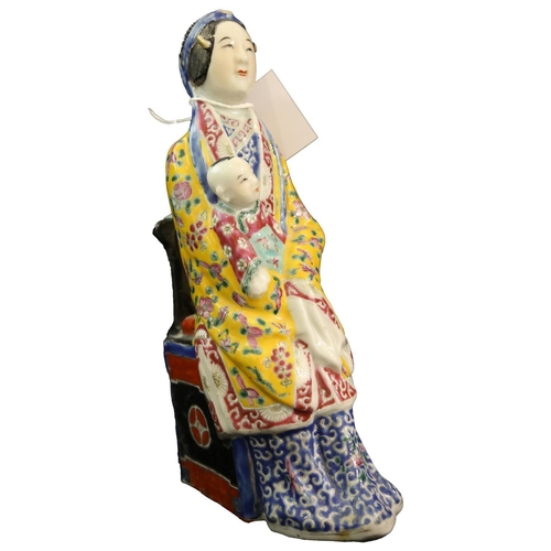 86 - A CHINESE SEATED FIGURINE OF A LADY HOLDING A BABY IN FULL COSTUME  25cm high           **PLEASE NOT... 