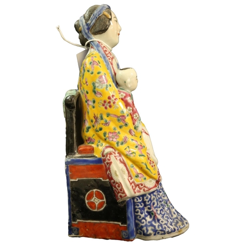 86 - A CHINESE SEATED FIGURINE OF A LADY HOLDING A BABY IN FULL COSTUME  25cm high           **PLEASE NOT... 