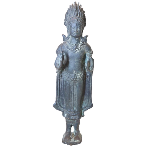 9 - A BRONZE STANDING FIGURE OF BUDDHA RAISED ON A SMALL OVAL BASE, SOUTH EAST ASIAN, 10.5cm high, Possi... 