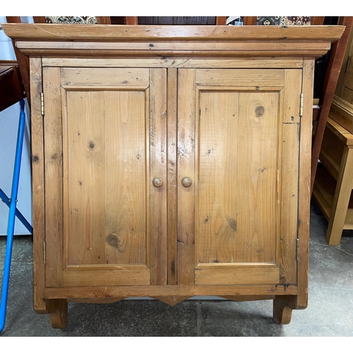 101 - WAXED PINE TWO DOOR HANGING CUPBOARD