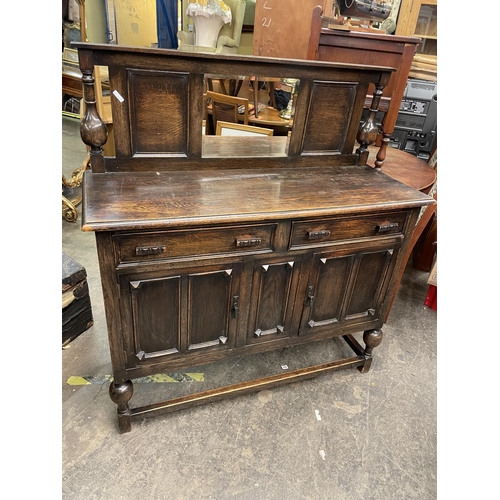 115 - OAK PANEL FRONTED SIDEBOARD WITH MIRRORED BACK