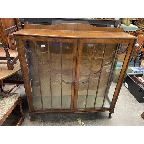 121 - WALNUT BOW FRONTED GLAZED CABINET ON CABRIOLE LEGS