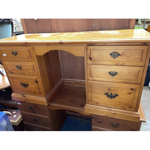 184 - PINE SEVEN DRAWER KNEEHOLE DRESSING TABLE