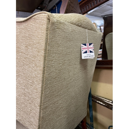 218 - FABRIC UPHOLSTERED WING ARMCHAIR