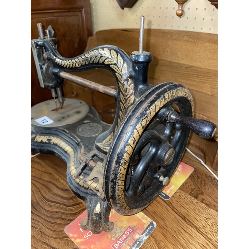 12 - VINTAGE JONES SEWING MACHINE WITH BLACK ENAMELLED AND GILDED DECORATION