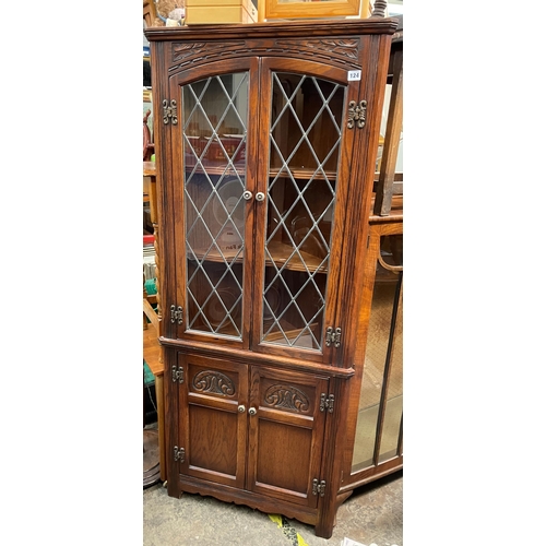 124 - OLD CHARM CARVED LEADED GLAZED CORNER CABINET