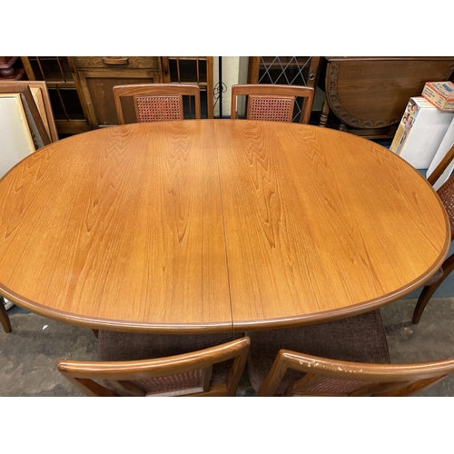 128 - G PLAN TEAK OVAL DINING TABLE AND SIX ROSEWOOD BERGERE CANED PANEL CHAIRS